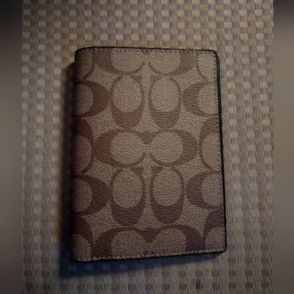 Iconic COACH brand passport case
